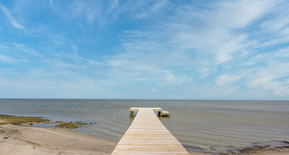 Take a stroll on the private boardwalk to the sound and take in the captivating water views.