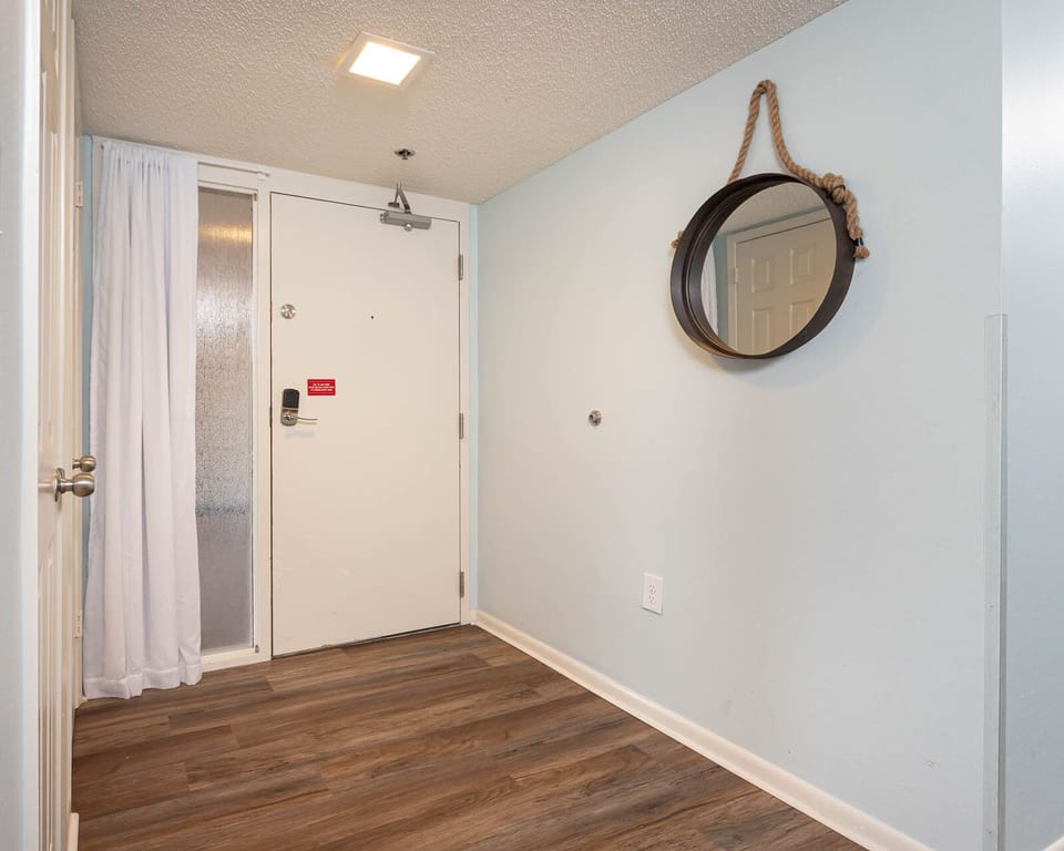 Step into a welcoming entryway, where coastal decor sets the perfect vibe for your beach getaway