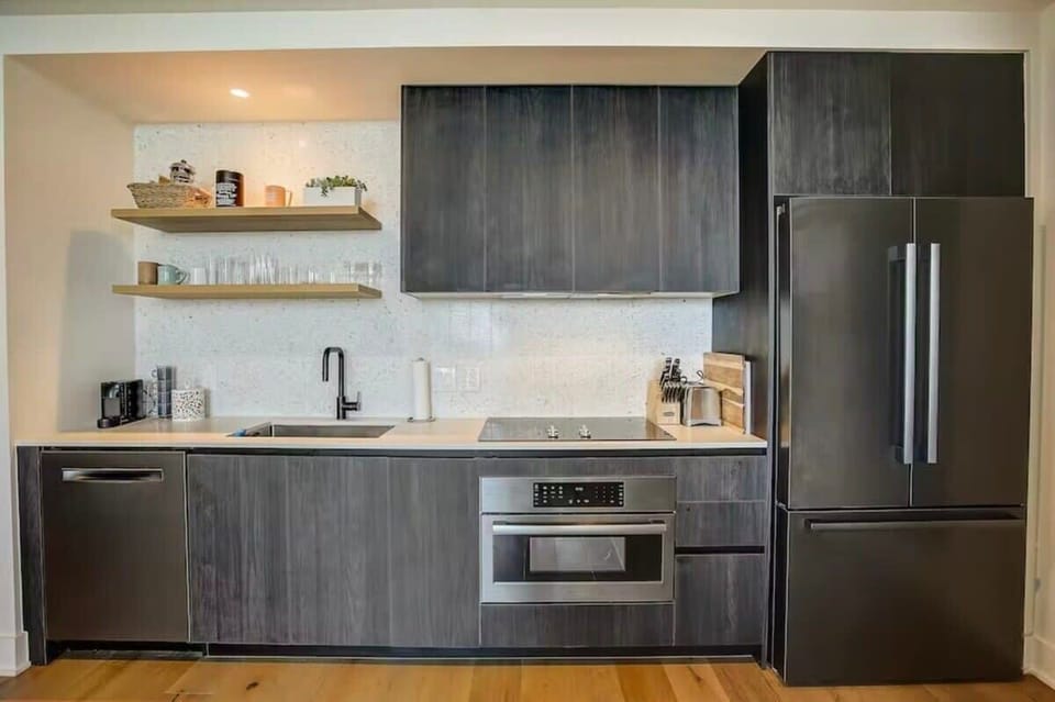Full kitchen with dishwasher, coffee maker and other amenities
