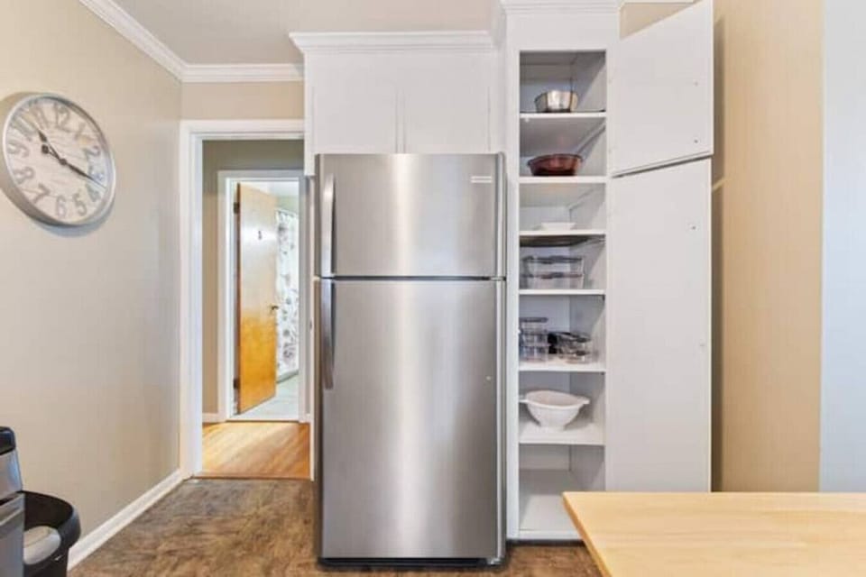 Additional kitchen view, lots of bowls and cooking essentials available for guest use.