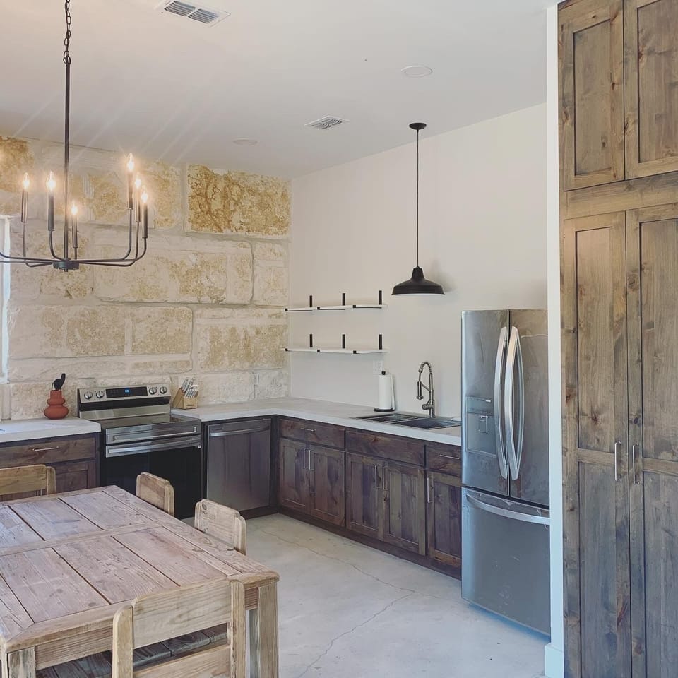 The microwave is located inside the pantry.