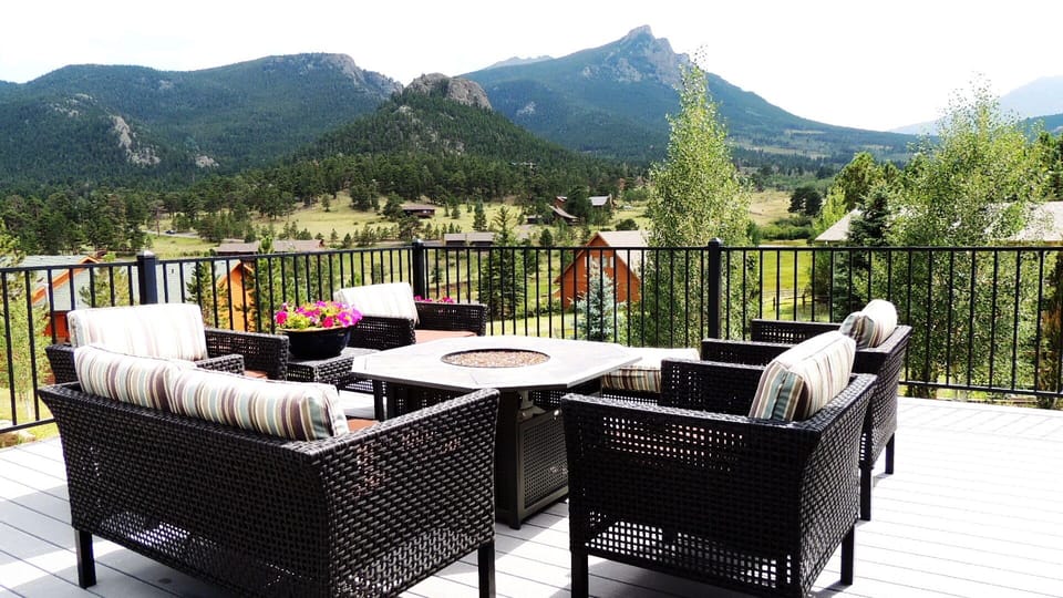 Back deck with amazing views, seating, gas fire pit table, hot tub and grill