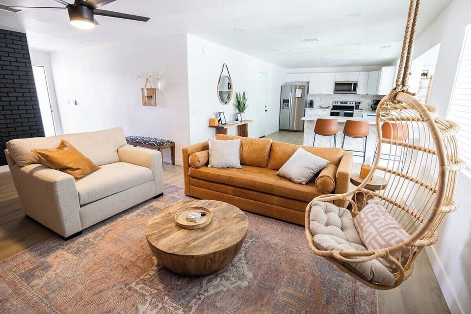 A spacious living room with room for entertaining. Featuring a queen pull out sofa! Large Roku Tv with lots of apps to log into and great high speed internet/wifi. 