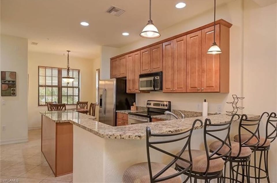 Kitchen view into breakfast nook.