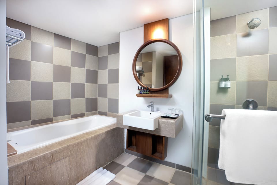 Junior Suite | Bathroom | Shower, rainfall showerhead, hair dryer, slippers