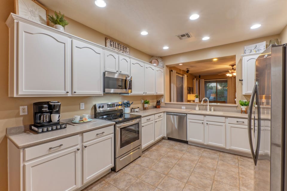 Kitchen is completely stocked for prepping and serving home cooked meals.