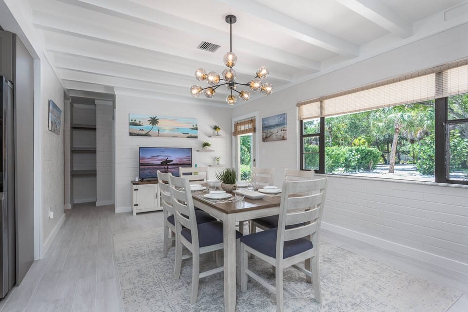 Off the kitchen is a beautiful dining room for 6 with a Smart TV (no cable) and remote faux fireplace