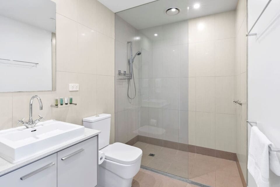 Bathroom with walk-in shower and clean modern finishes