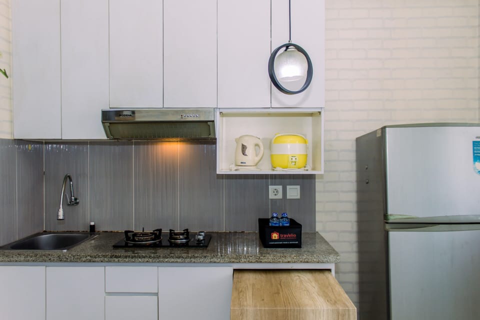 Fridge, stovetop, cookware/dishes/utensils, dining table