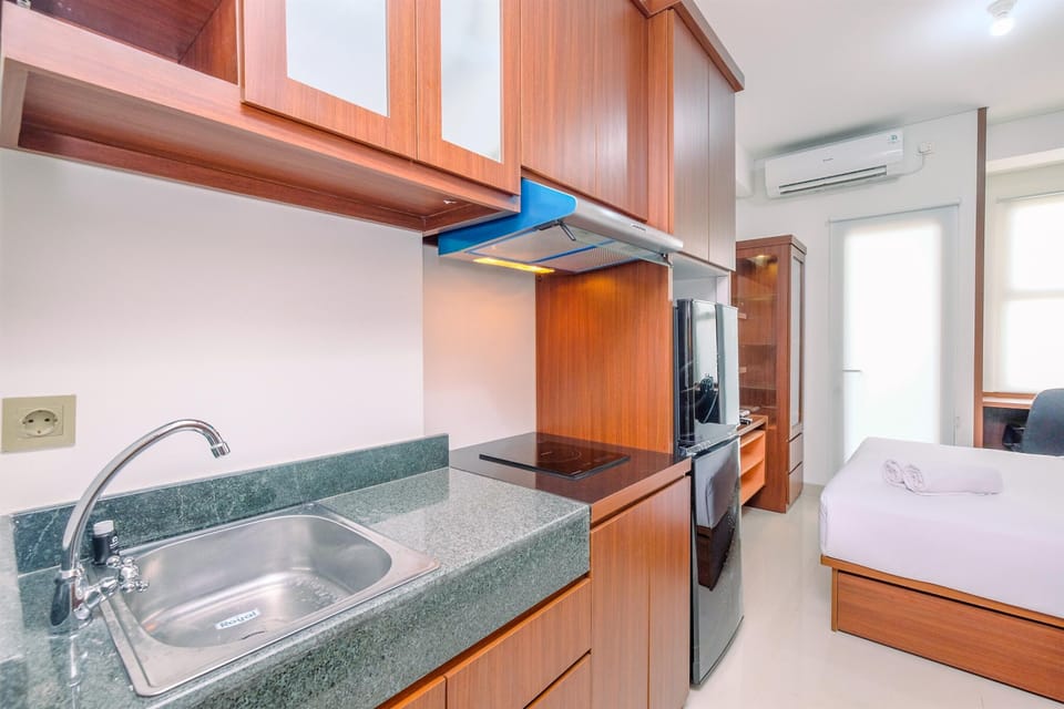 Fridge, stovetop, cookware/dishes/utensils, dining tables
