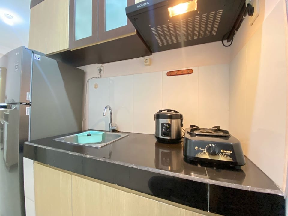Fridge, stovetop, cookware/dishes/utensils, dining tables