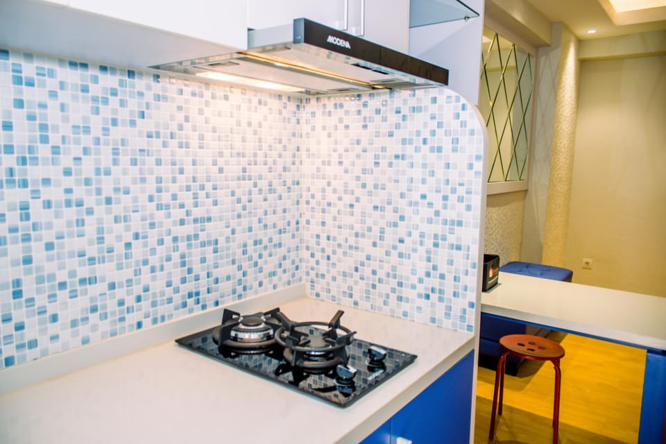Fridge, stovetop, cookware/dishes/utensils, dining tables