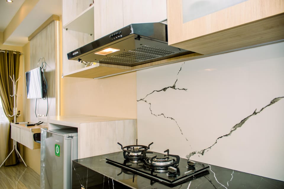 Fridge, stovetop, cookware/dishes/utensils, dining tables