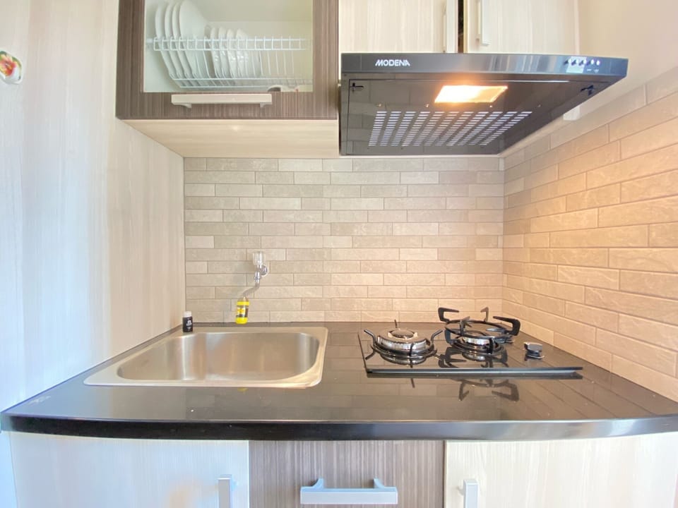 Fridge, stovetop, cookware/dishes/utensils, dining tables