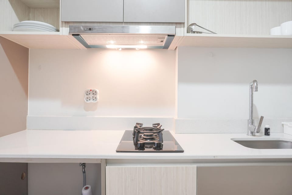 Fridge, stovetop, cookware/dishes/utensils, dining tables