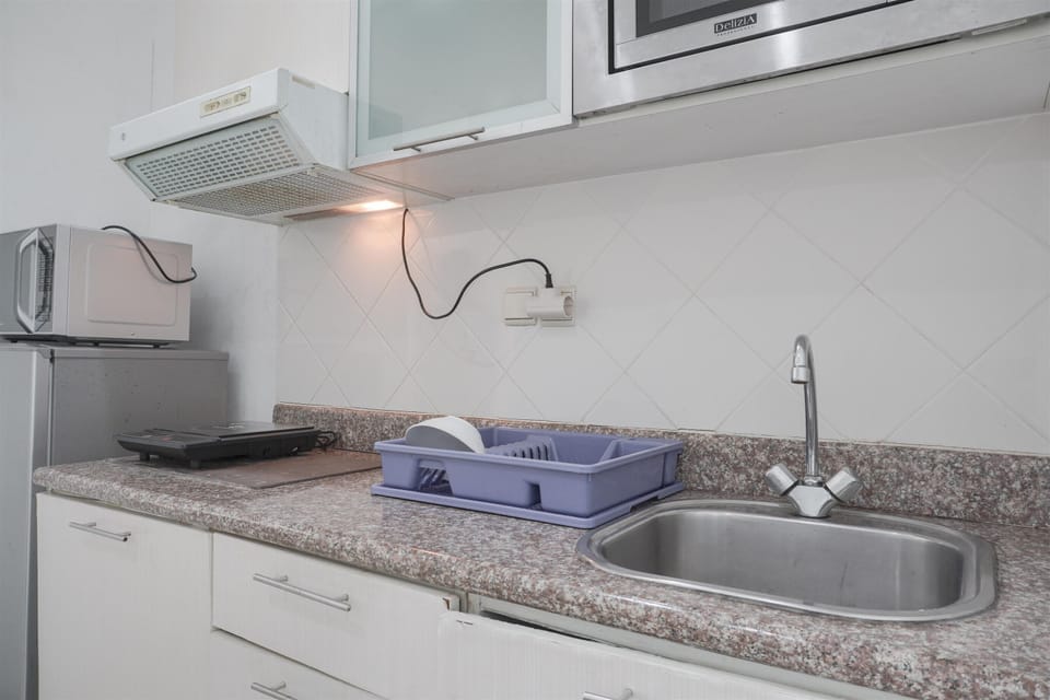 Fridge, stovetop, cookware/dishes/utensils, dining tables