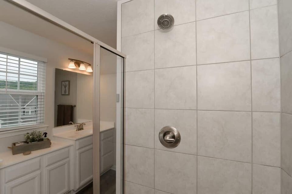 The master bath features a sleek stand-up shower, offering a quick and invigorating experience. Meanwhile, the second bathroom includes a relaxing bathtub, perfect for unwinding and enjoying a soothing soak after a busy day.
