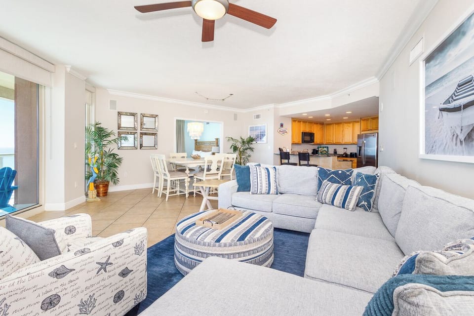 Sink into coastal comfort in your bright living space with ocean-inspired blues and soft grays creating the perfect beach retreat.