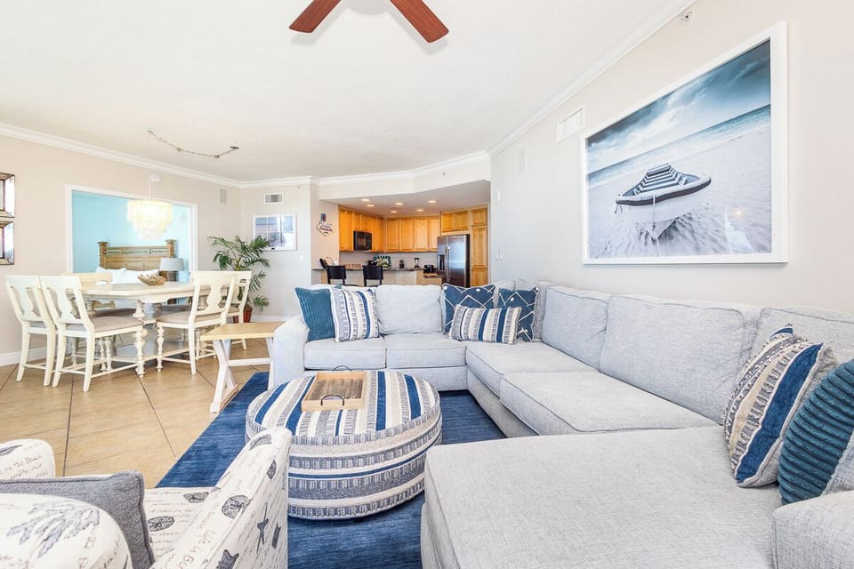 Sink into this comfortable sectional where coastal blues meet warm whites, creating your perfect spot for morning coffee or evening relaxation.