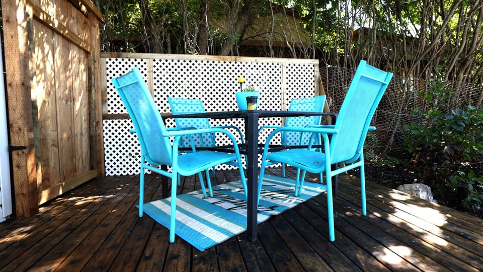 Back deck with dining area. 