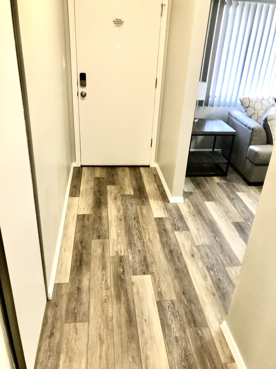Wide entryway with coat closet. High chair and pack in play located in closet