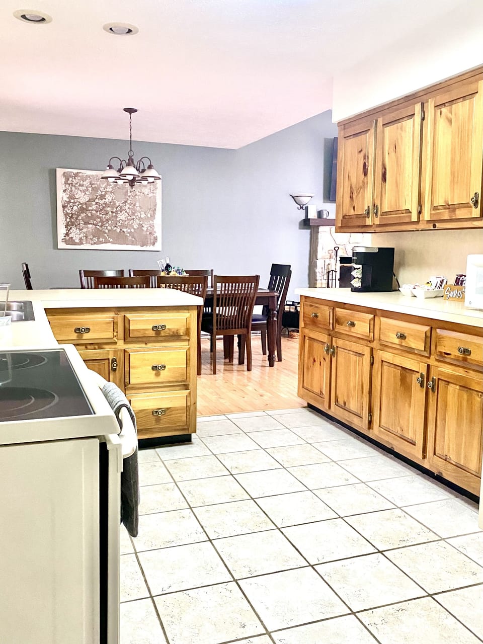 Stocked  kitchen with counter top ice maker, and Keurig and drip coffee makers