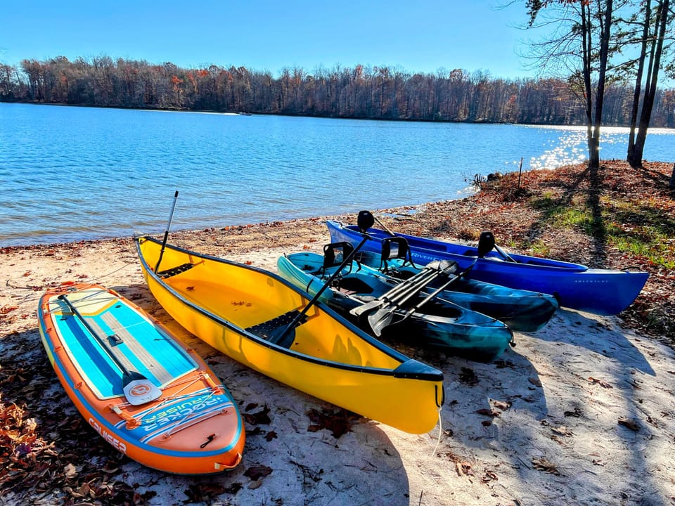 Adventure awaits on our **120-foot private beach!** Enjoy **160+ feet of lakefront** with a gentle sandy bottom—perfect for paddling, kayaking, and stand-up paddleboarding in warm freshwater. Grab a boat and explore the lake! ‍♂️✨