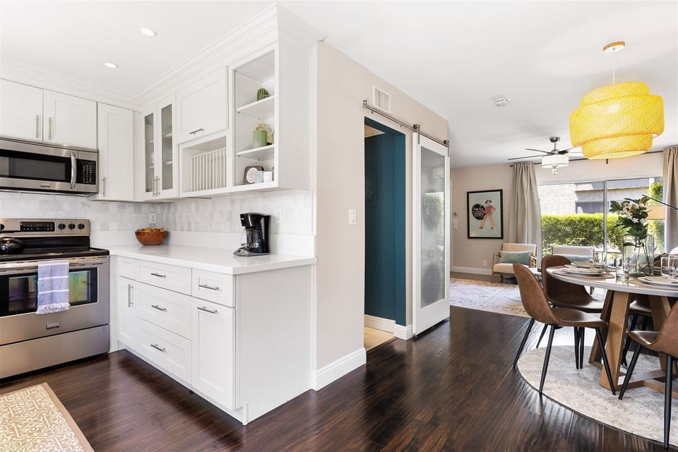 Kitchen opens into dining area for easy convenience 