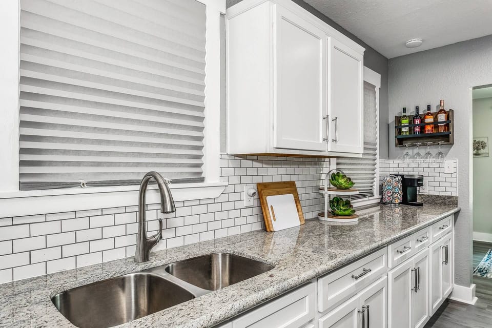 New granite counters and tile backsplash