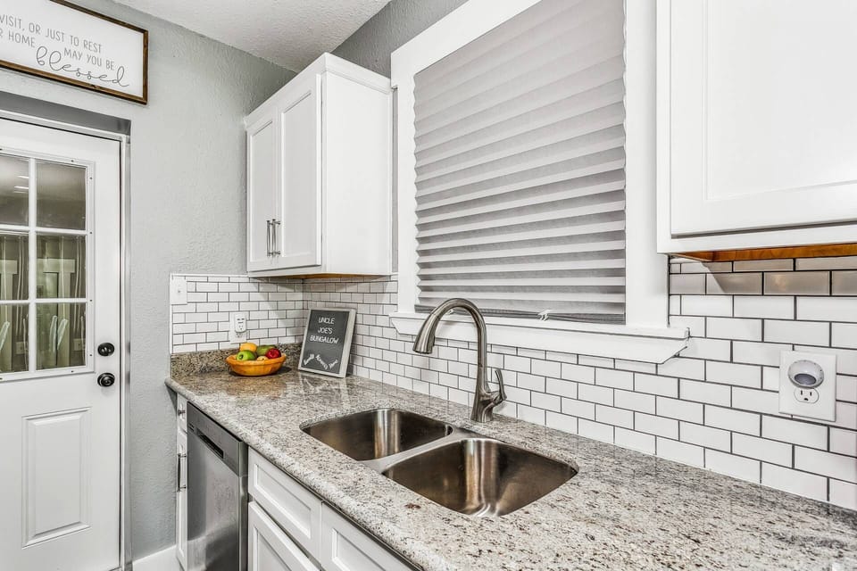 The laundry room is just off the kitchen