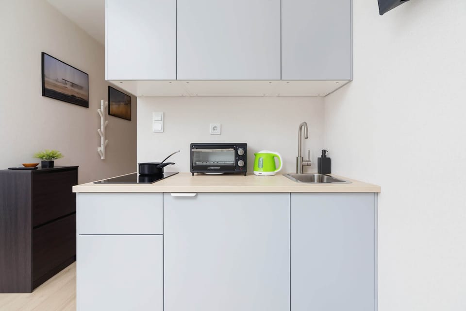 The fully equipped kitchenette includes everything you need for a home-cooked meal.