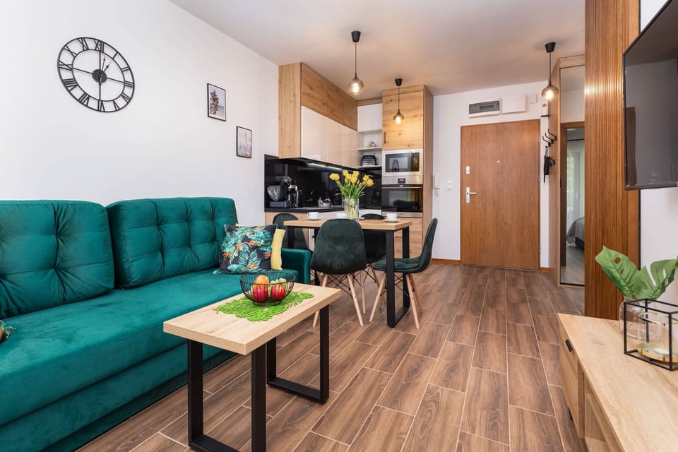 The living room's sleek design is both functional and aesthetically pleasing.