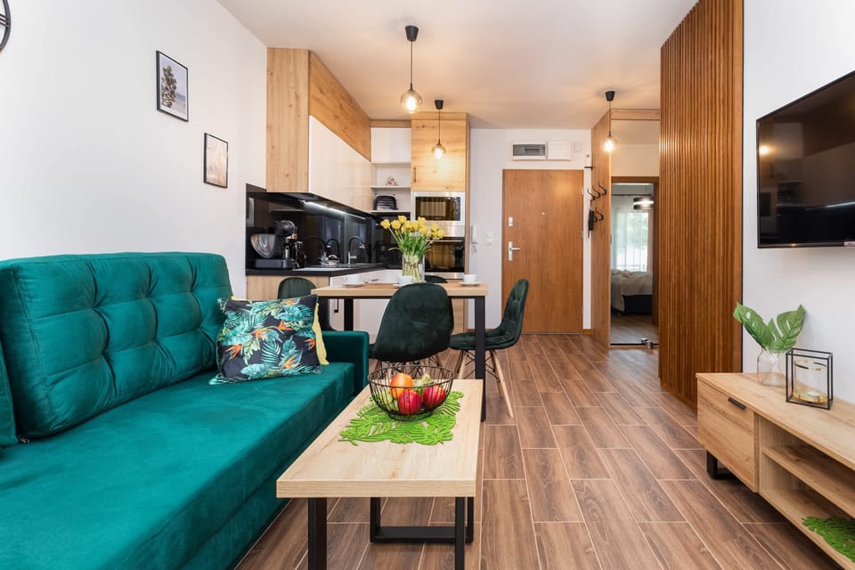 The elegant living room featuring a double sofa bed.