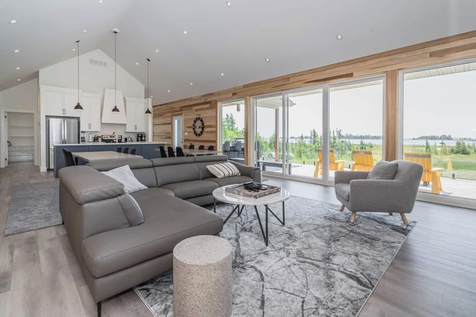 The Great room is large enough for any family, but understated and without pretense. Enjoy the incredibly comfortable De'Boer & Company sofas. 