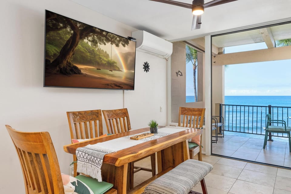 Living area with great art~ large dining table and ocean view