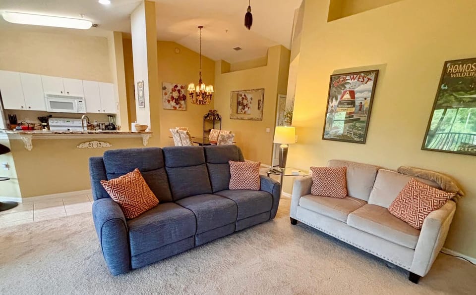 Living Room with two sofas, a chair, and a 55" HD TV (2)