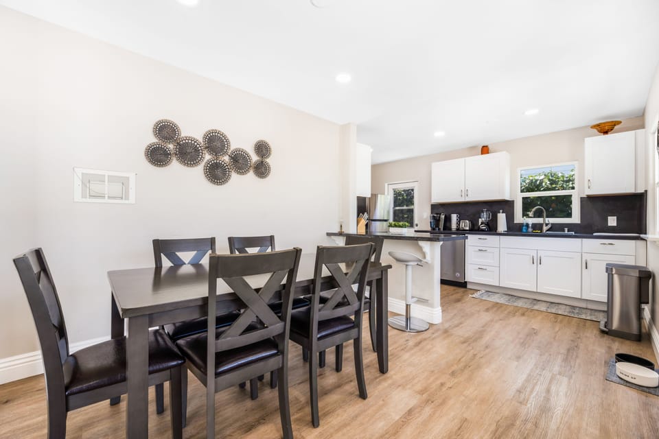 Dining table located directly off the kitchen and seats six. 