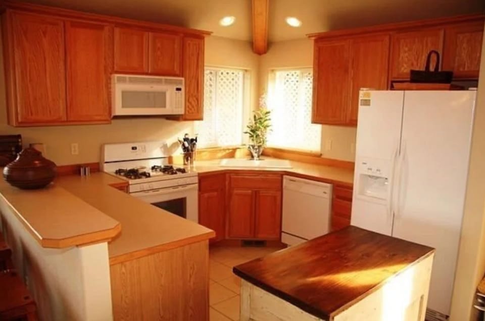 Well stocked kitchen (island has been removed).