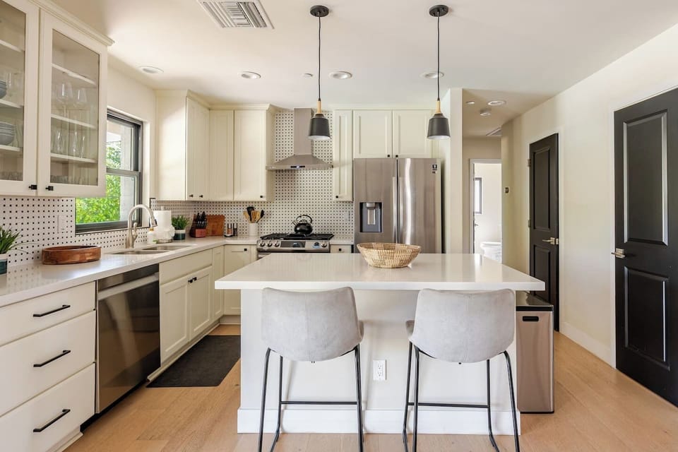 Start your mornings here with a cup of coffee and great conversation. This bright corner of the kitchen invites comfort and connection.