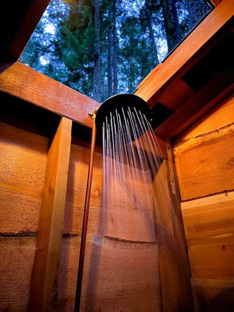 Some people enjoy the outdoor shower as much as the hot tub! The opening above the shower to the trees and sky will entice you to enjoy the warm water even longer.