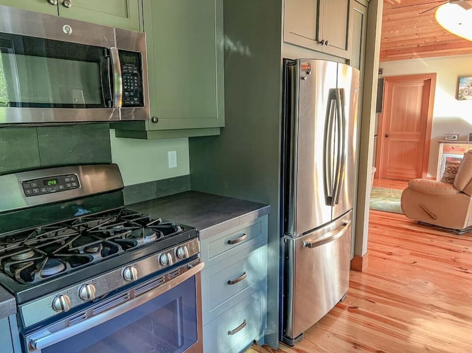 Large refrigerator holds everything you need for your stay, and the pull out freezer has a built in ice maker.