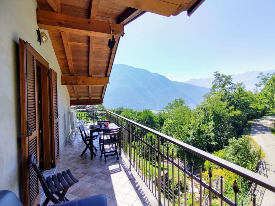 Sky, Building, Property, Furniture, Plant, Porch, Wood, Mountain, Shade, Fence
