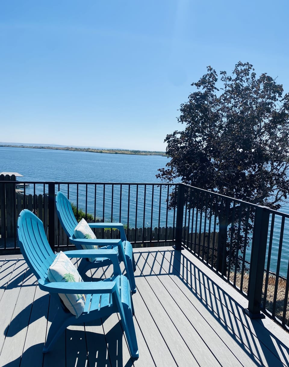 Spacious 1,500 square foot deck. Overlooking private pool, private dock and lake