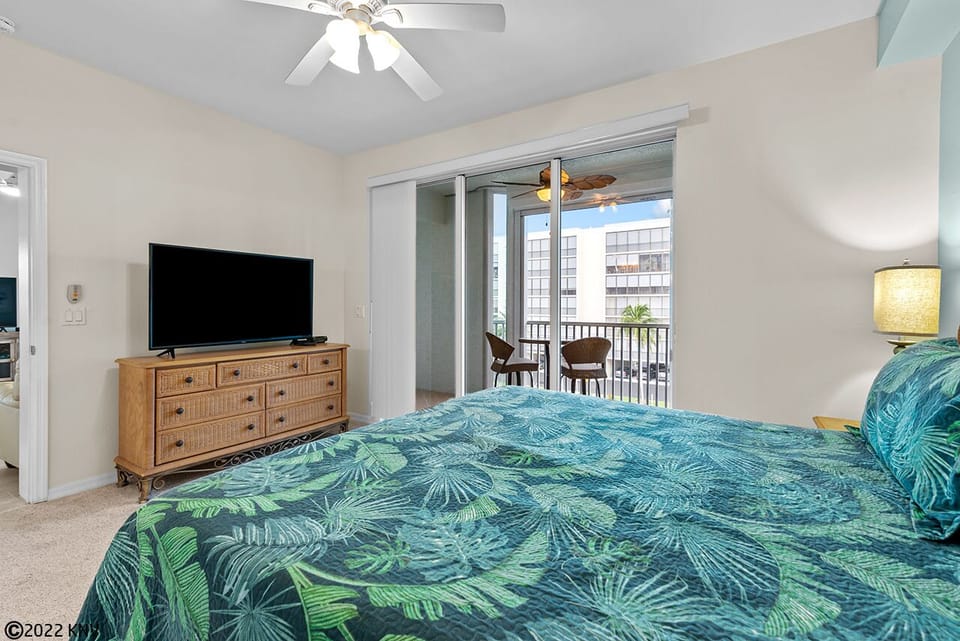 Master Bedroom has a private lanai access and its own TV