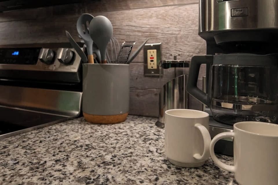 Start your morning right with a fresh cup of coffee—this fully stocked kitchen includes all the essentials for a cozy breakfast.