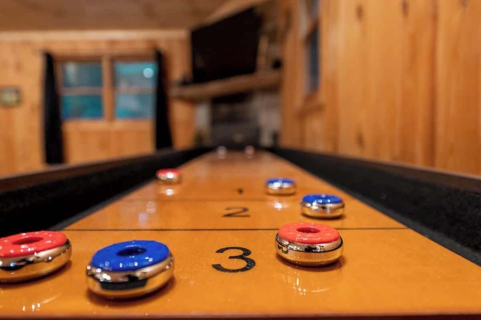 Enjoy hours of friendly competition on the indoor shuffleboard table in a cozy, cabin-style setting.