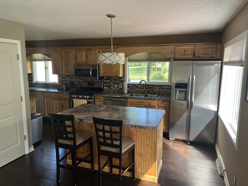 Kitchen island with two bar stools 