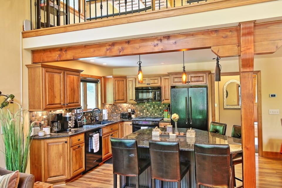 conveniently located kitchen with wine/mini fridge built into the island