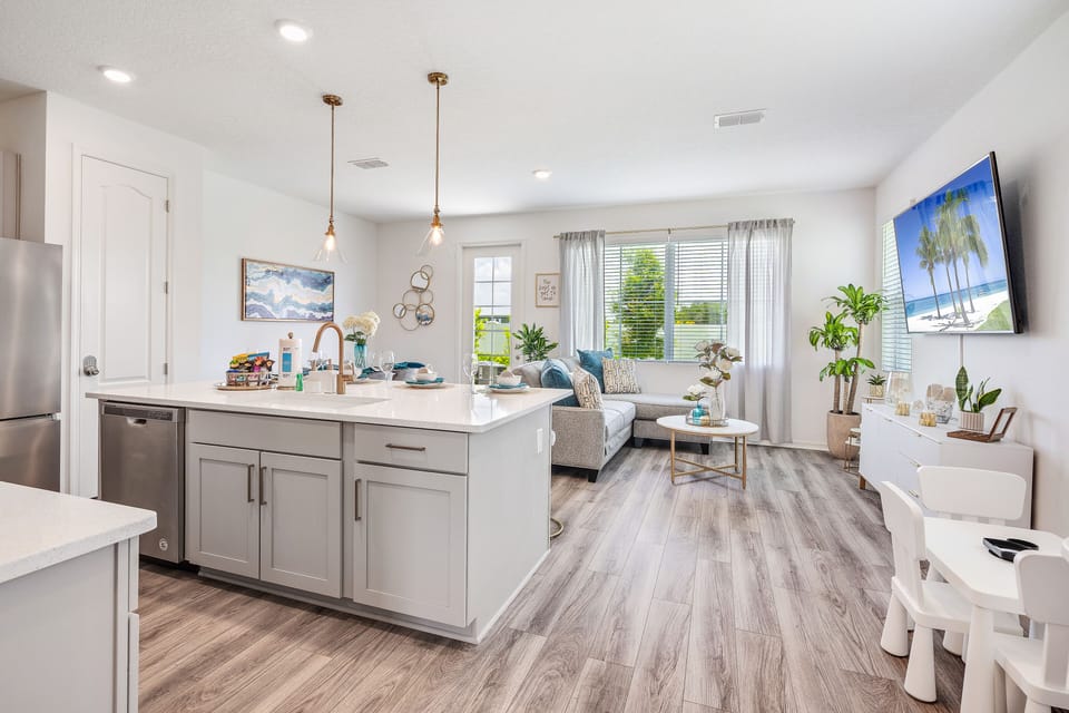 First floor is an open floor concept w/ 75-in smart TV and fully stocked kitchen