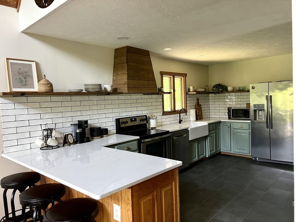 Spacious kitchen area; Stove, dishwasher, microwave, and fridge 